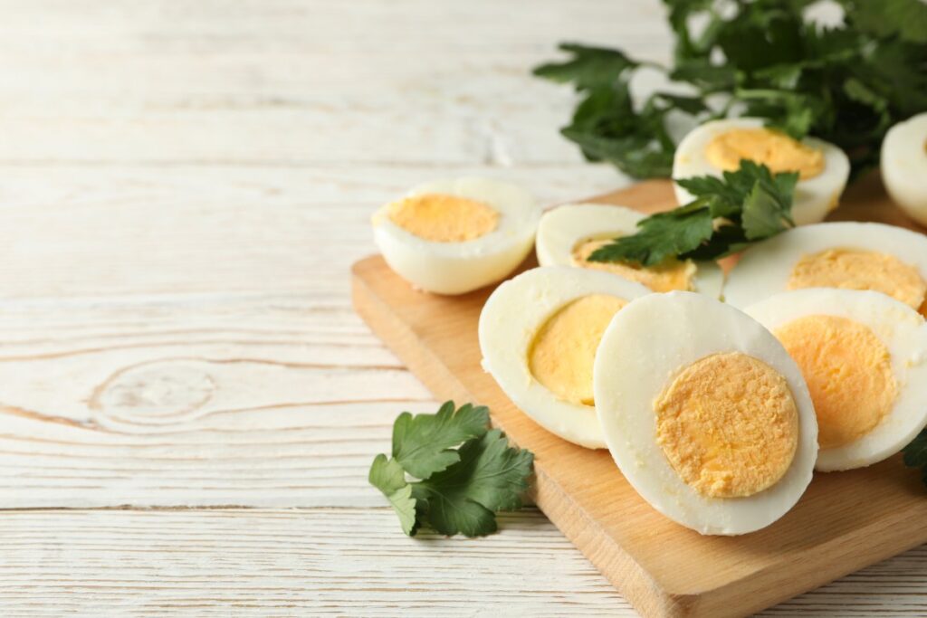 Boiled eggs on wooden board