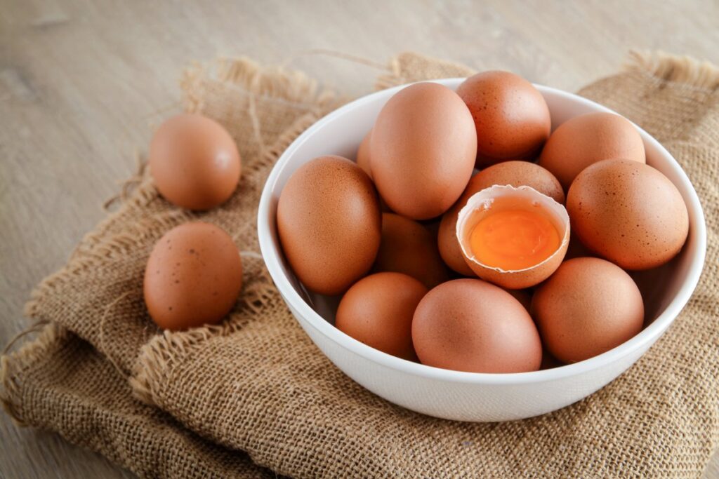 Chicken eggs in white bowl