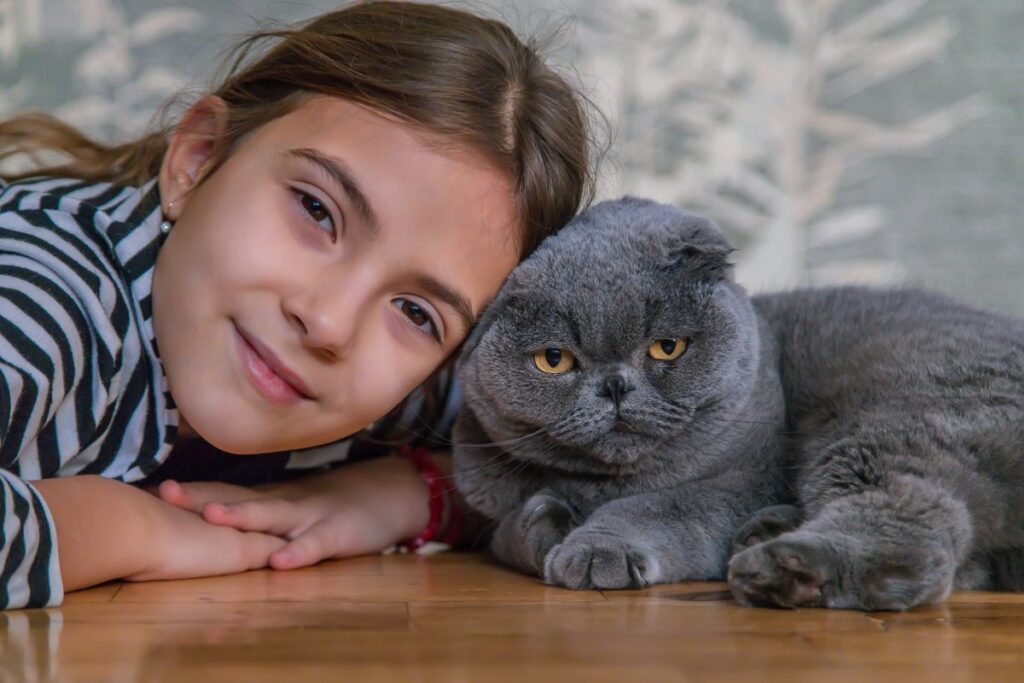 Girl at home with her cat