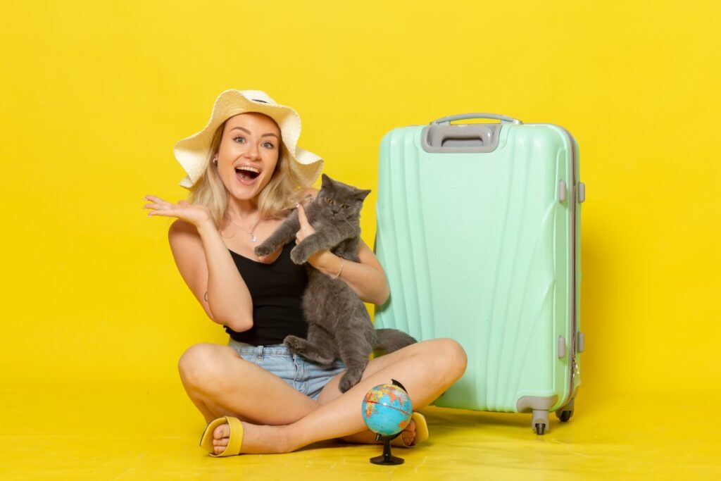 A young woman is going on a trip with her cat